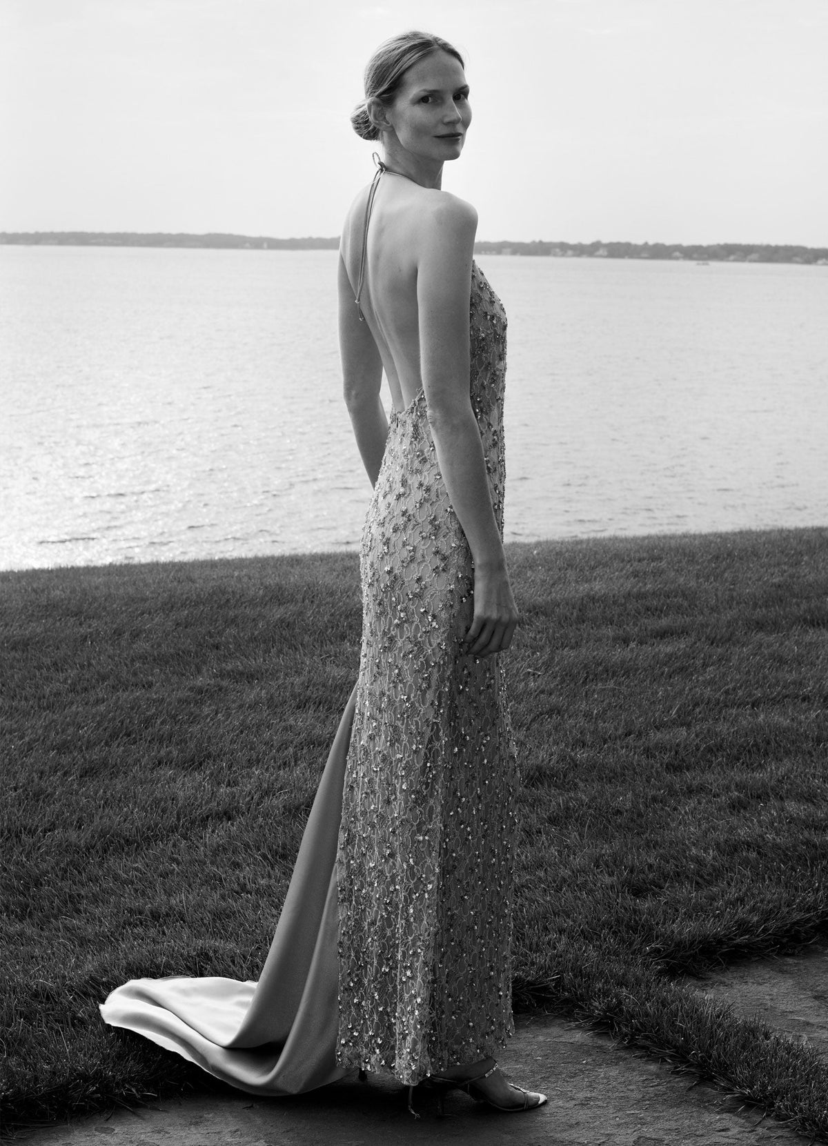 SCHOENBACH embellished evening gown with open back, defined by intricate detailing and a long, fluid line