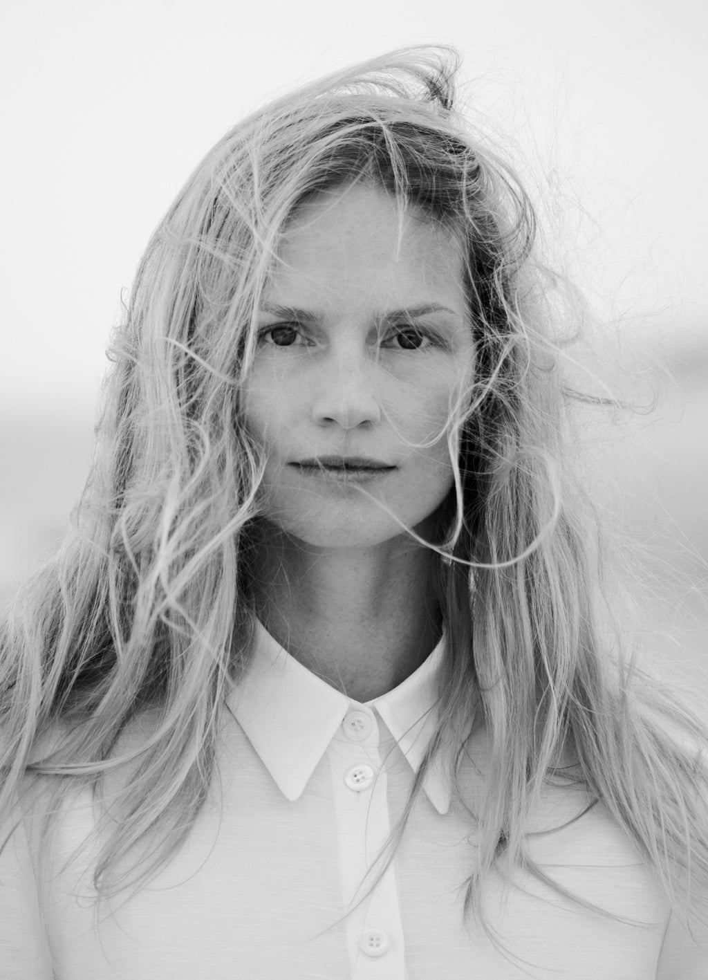 Model wearing white shirt dress with classic collar