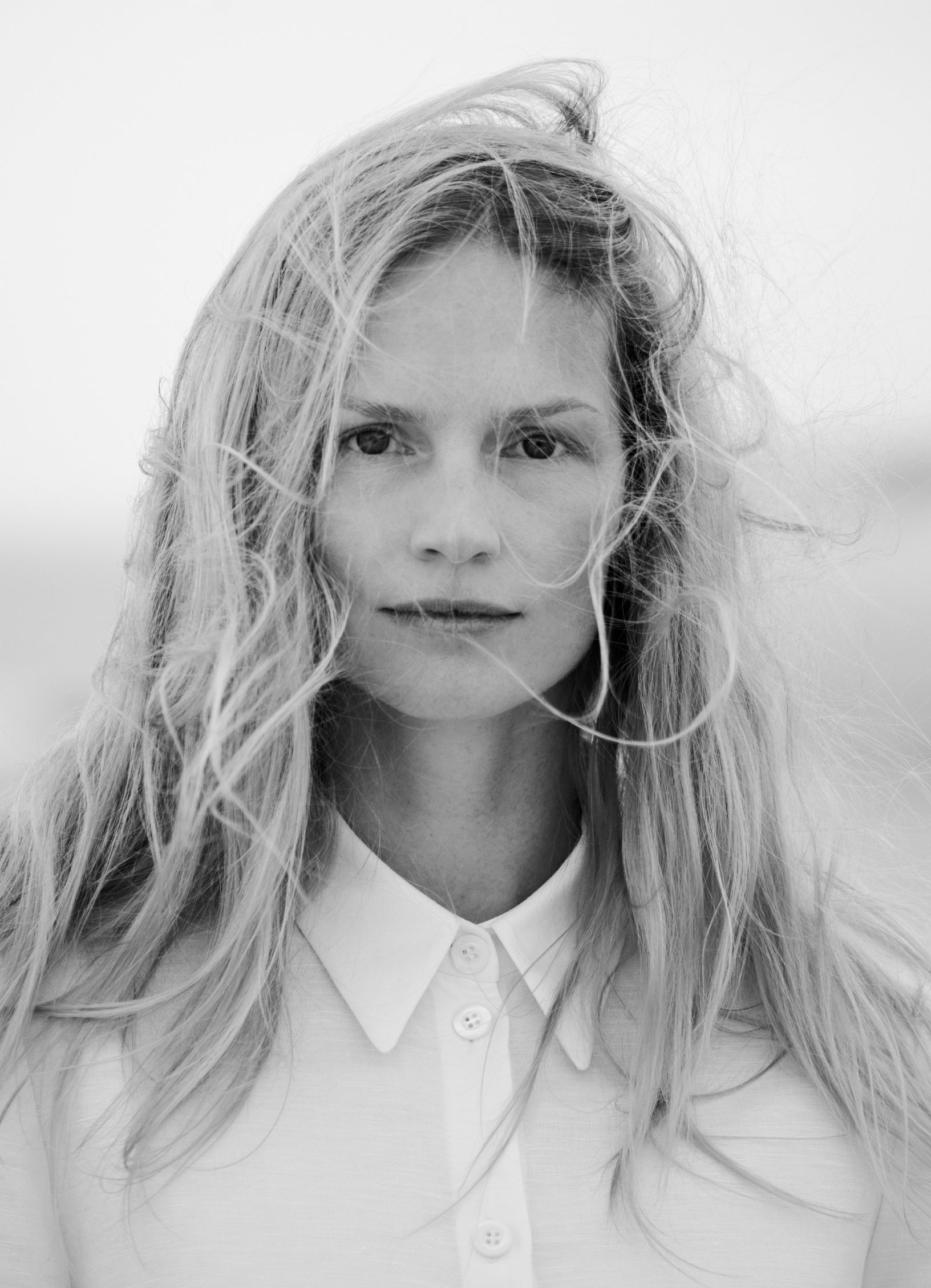 Model wearing white shirt dress with classic collar