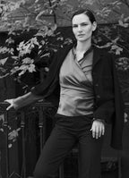 Black cropped wool jacket styled with tailored trousers