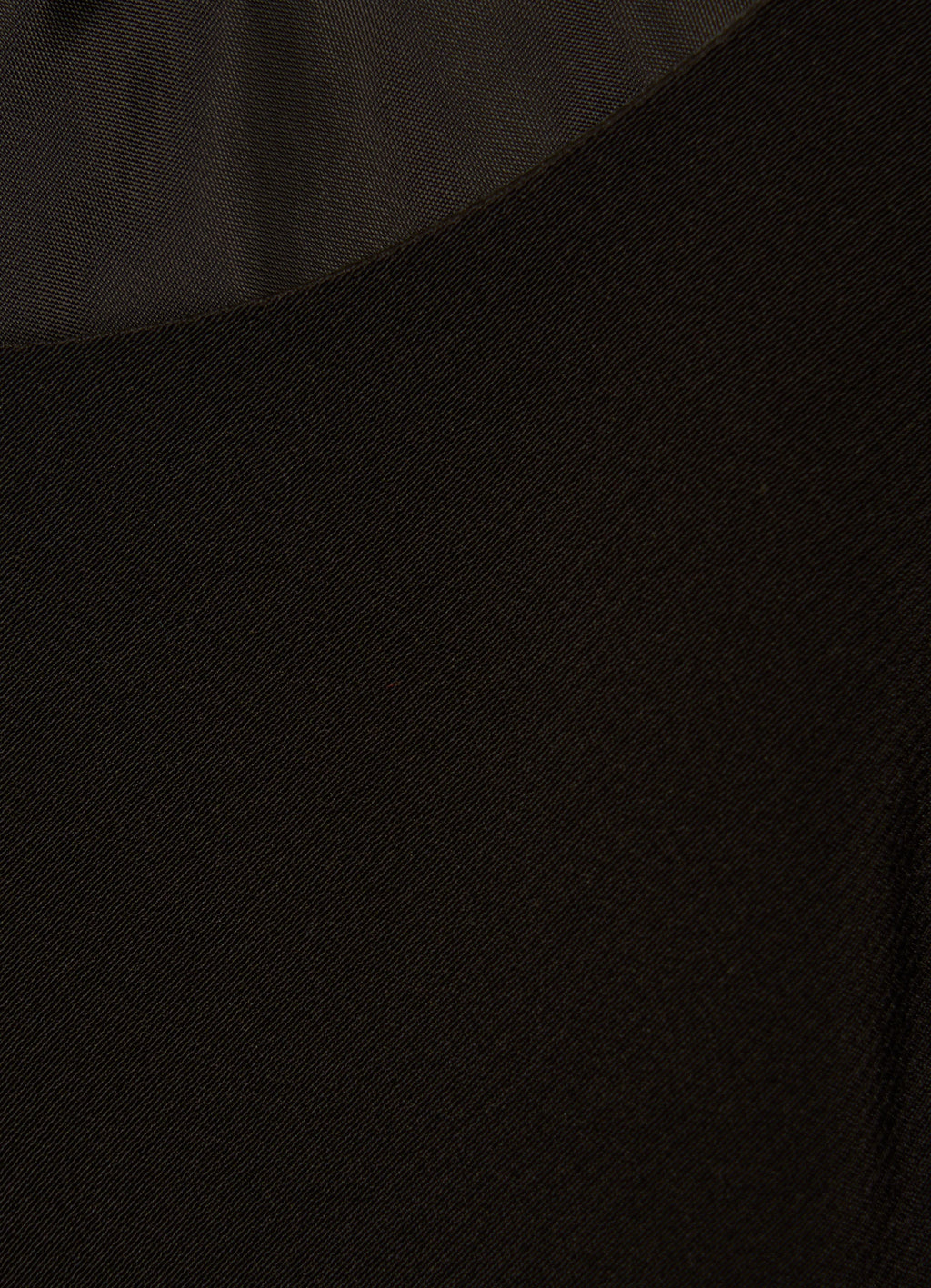 Close-up of black satin fabric texture