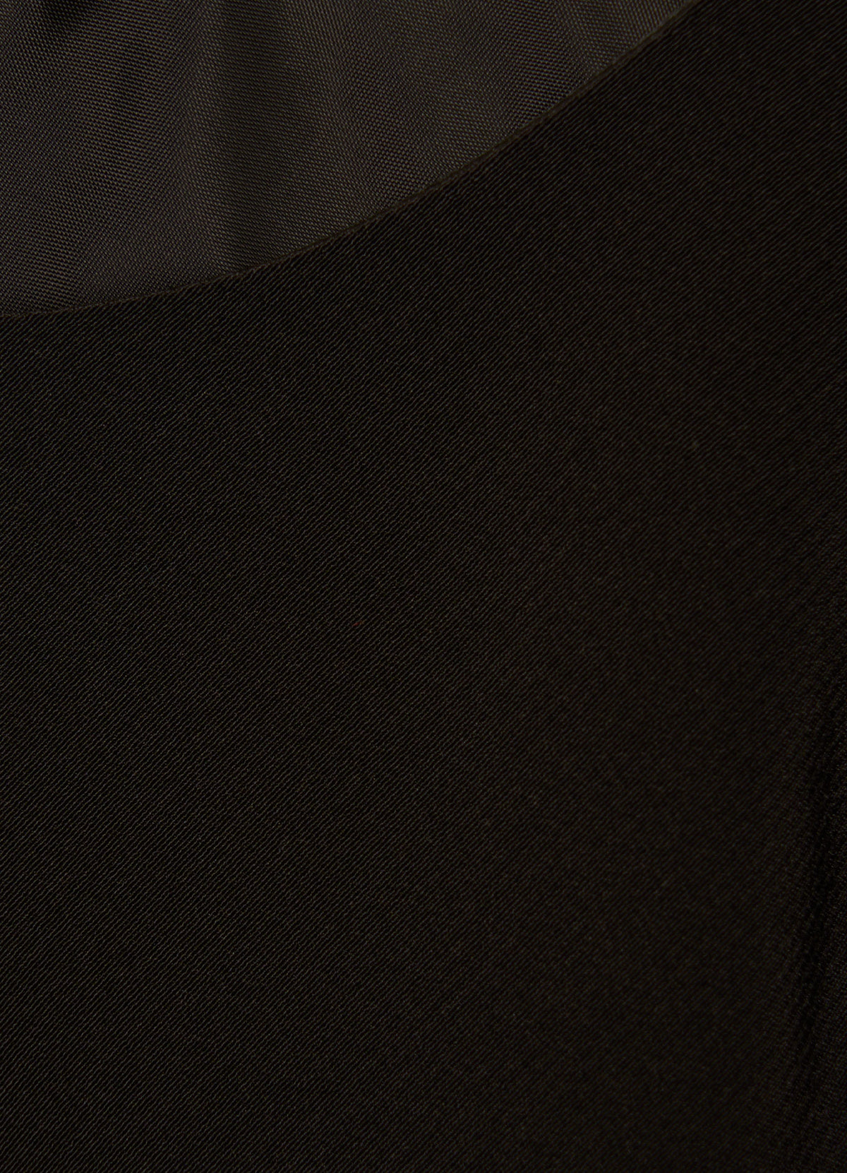 Close-up of black satin fabric texture