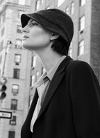 Model Sophie Grace Hirsch wearing black textured bucket hat with tailored black blazer in New York City