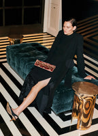 Black velvet-hem midi skirt styled for an evening look