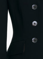 Close-up of SCHOENBACH double-breasted jacket with buffalo horn buttons in black virgin wool