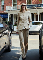 Camel wool-cashmere straight-leg trousers styled with tailored jacket in an urban setting
