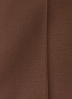 Close-up of chocolate brown wool trousers