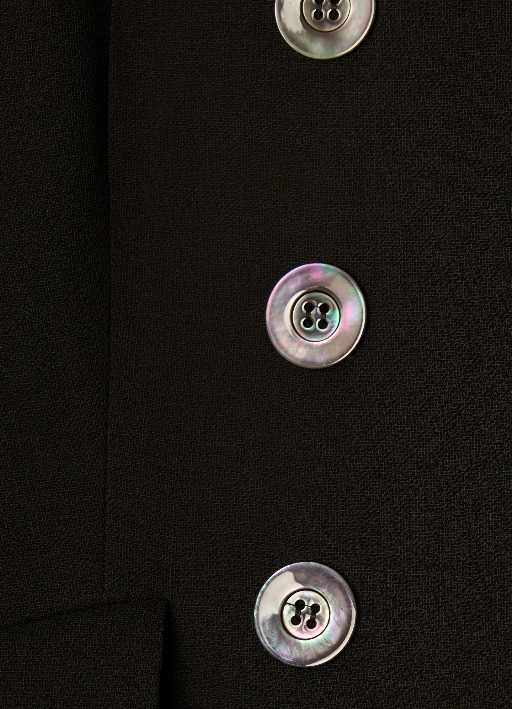 Close-up of buttons on black SCHOENBACH wool blazer