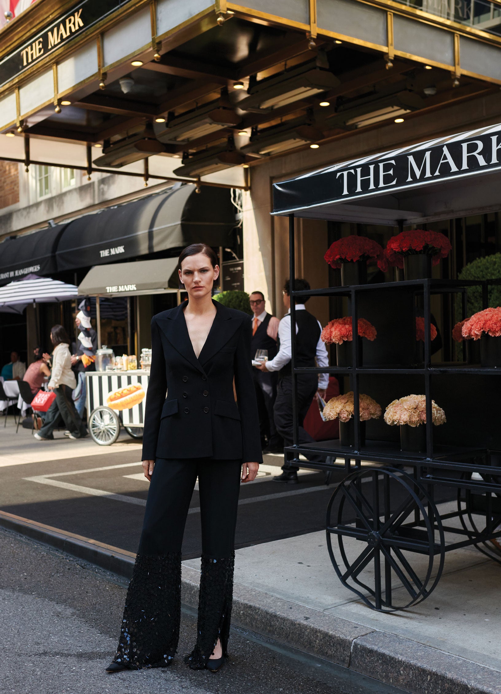 Black SCHOENBACH double-breasted blazer styled with sequin trousers. Featuring model Sophie Grace Hirsch in front of The Mark Hotel New York City