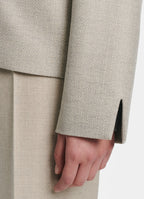 Detail of SCHOENBACH blazer cuff with clean straight sleeve finish in beige tailoring fabric