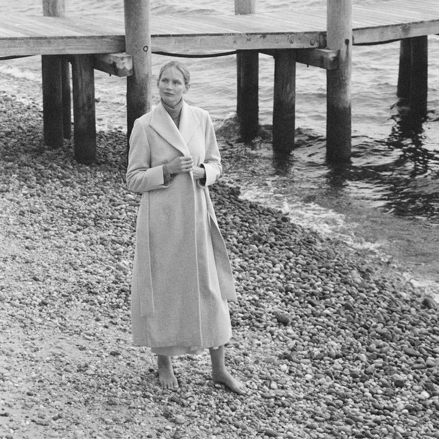 SCHOENBACH photo of model Katrin Thormann wearing a wool coat in the Hamptons