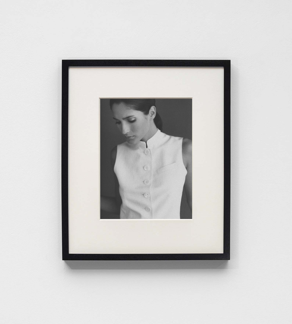 SCHOENBACH editorial highlighting refined tailoring in a structured white sleeveless vest