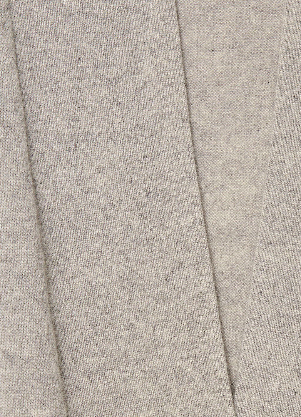 Close-up detail of the grey mélange cashmere knit texture and soft brushed finish.
