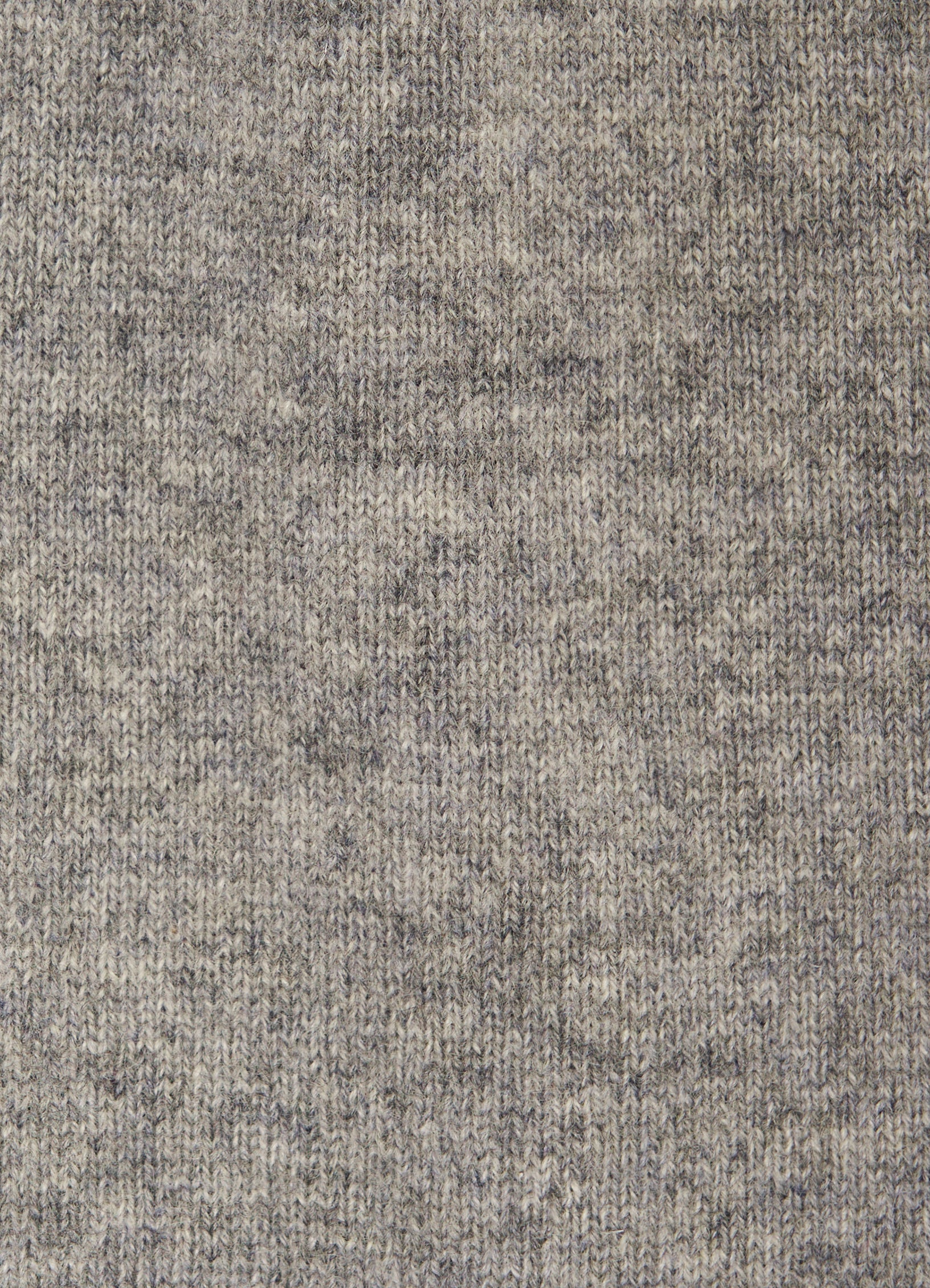 Close-up detail of fine gauge cashmere knit in light grey melange