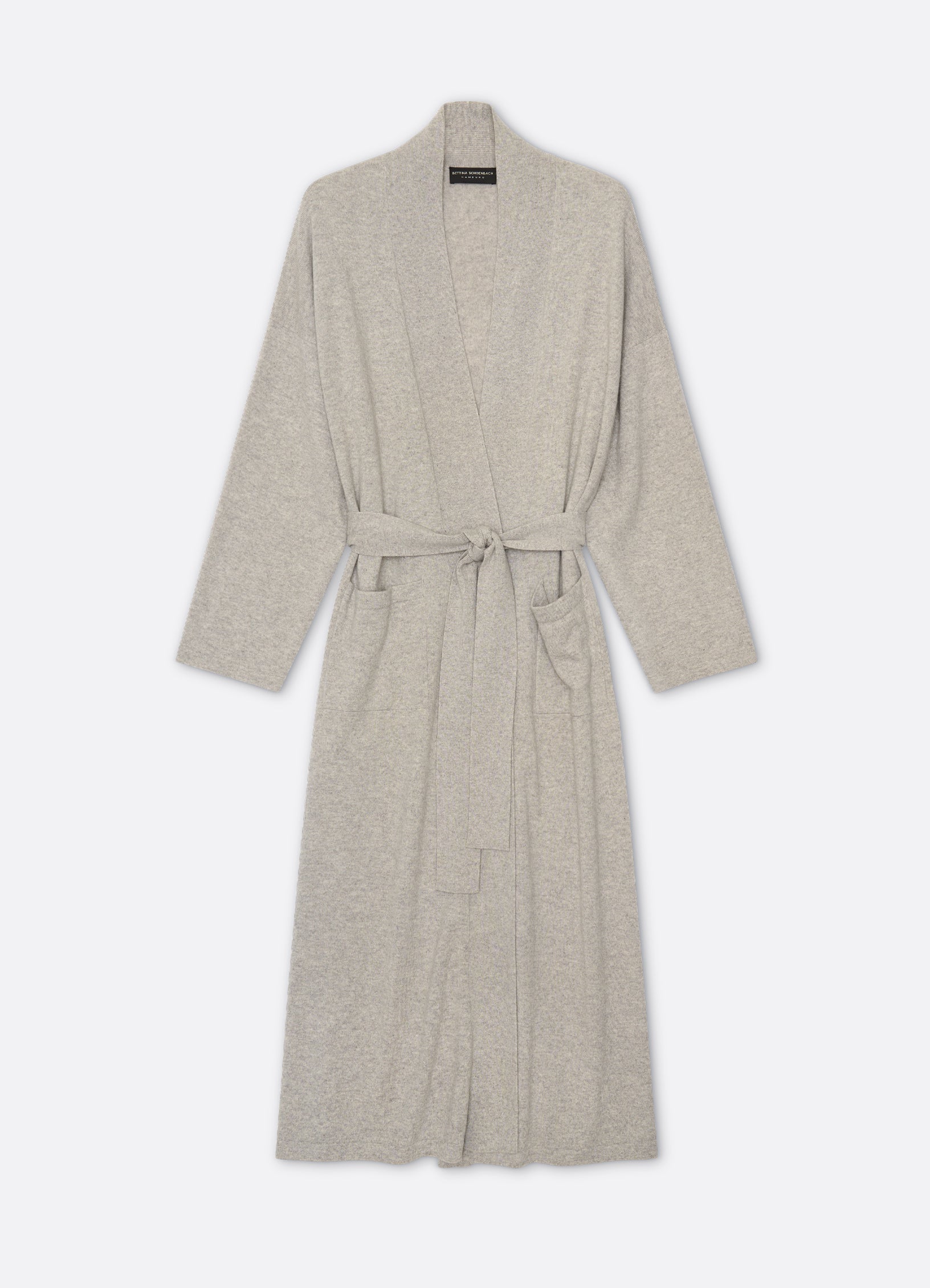 Front view of a long cashmere cardigan in soft grey mélange with a relaxed silhouette and shawl collar.