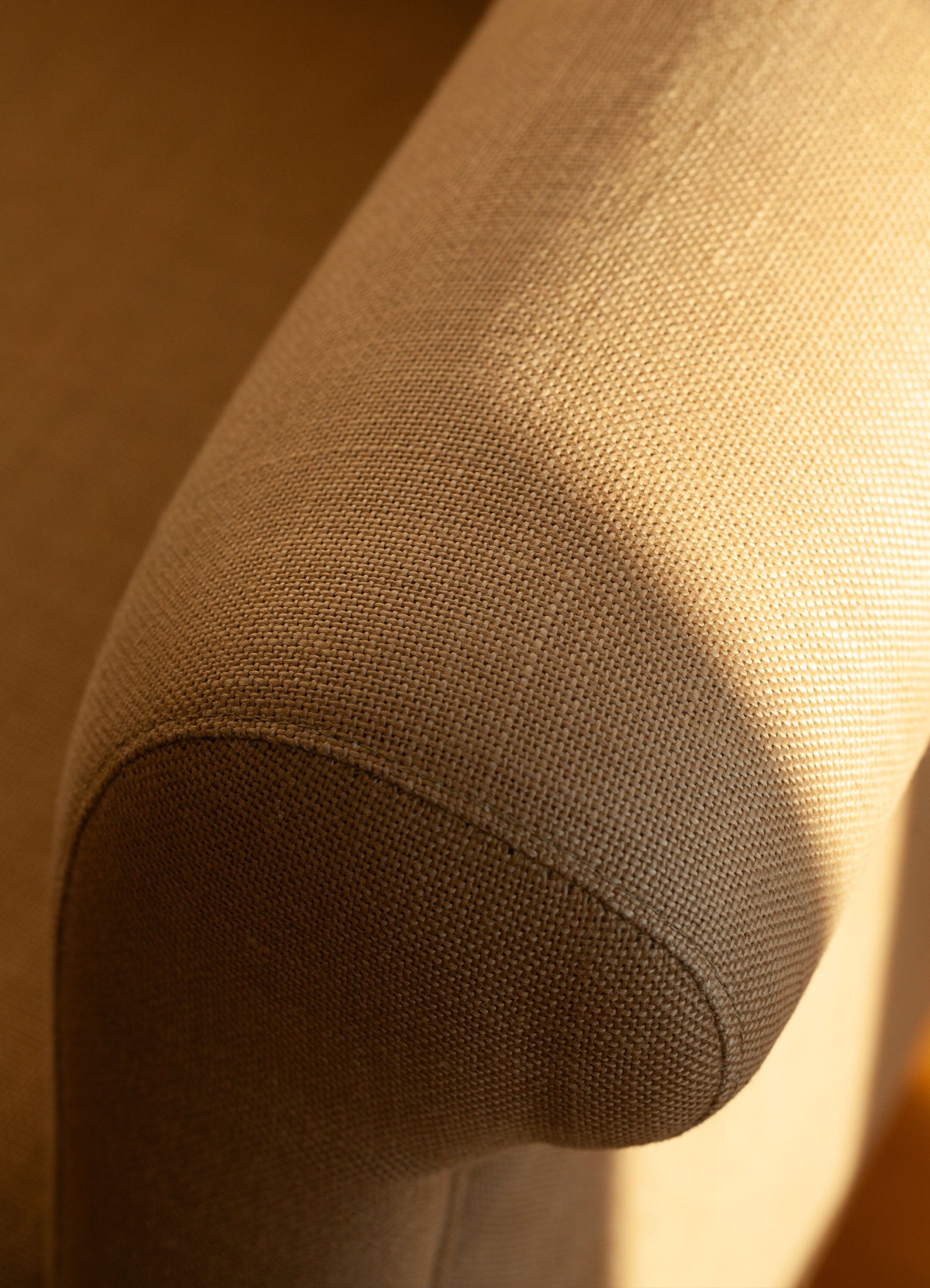 Close-up of a textured beige linen fabric surface of the SCHOENBACH Hamptons chair