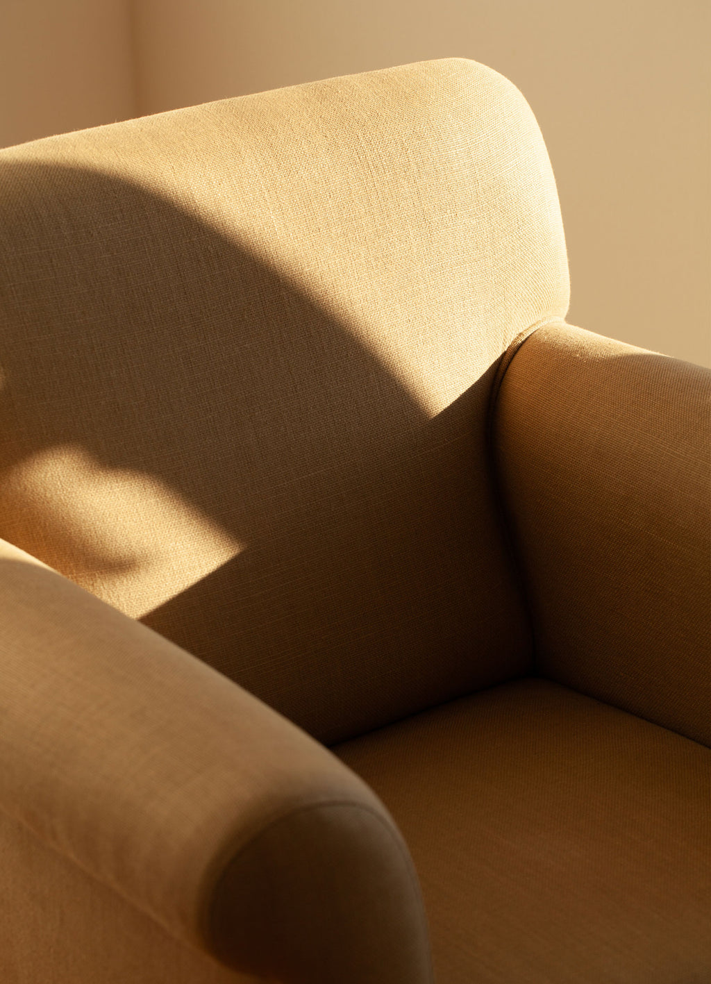 Close-up of a SCHOENBACH Hamptons armchair with soft lighting