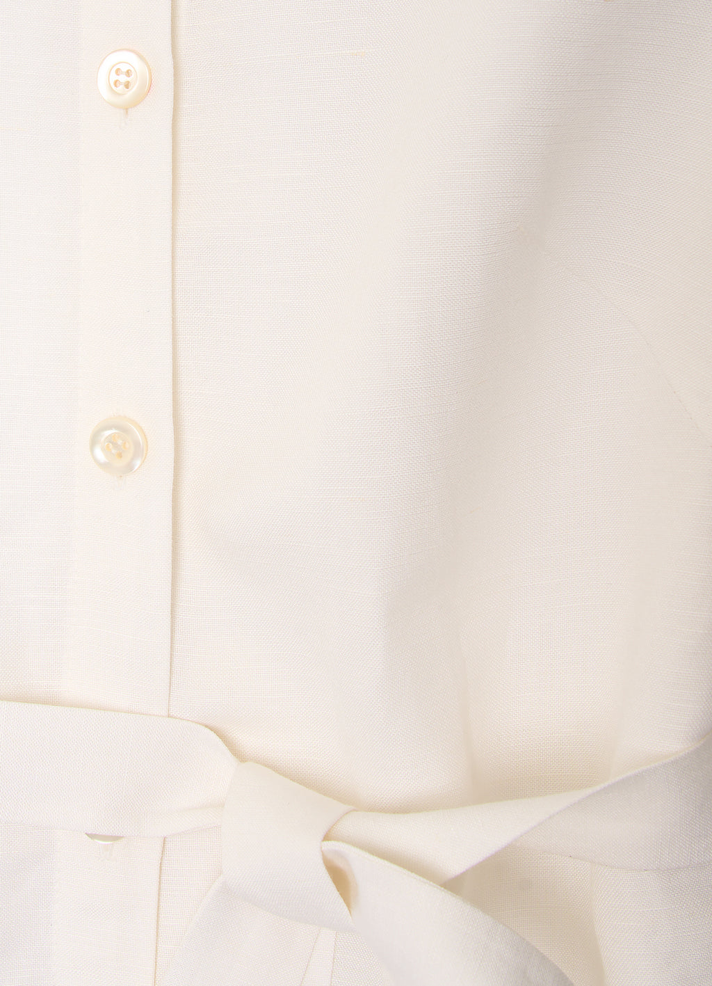 White shirt dress detail with mother-of-pearl buttons