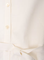 White shirt dress detail with mother-of-pearl buttons