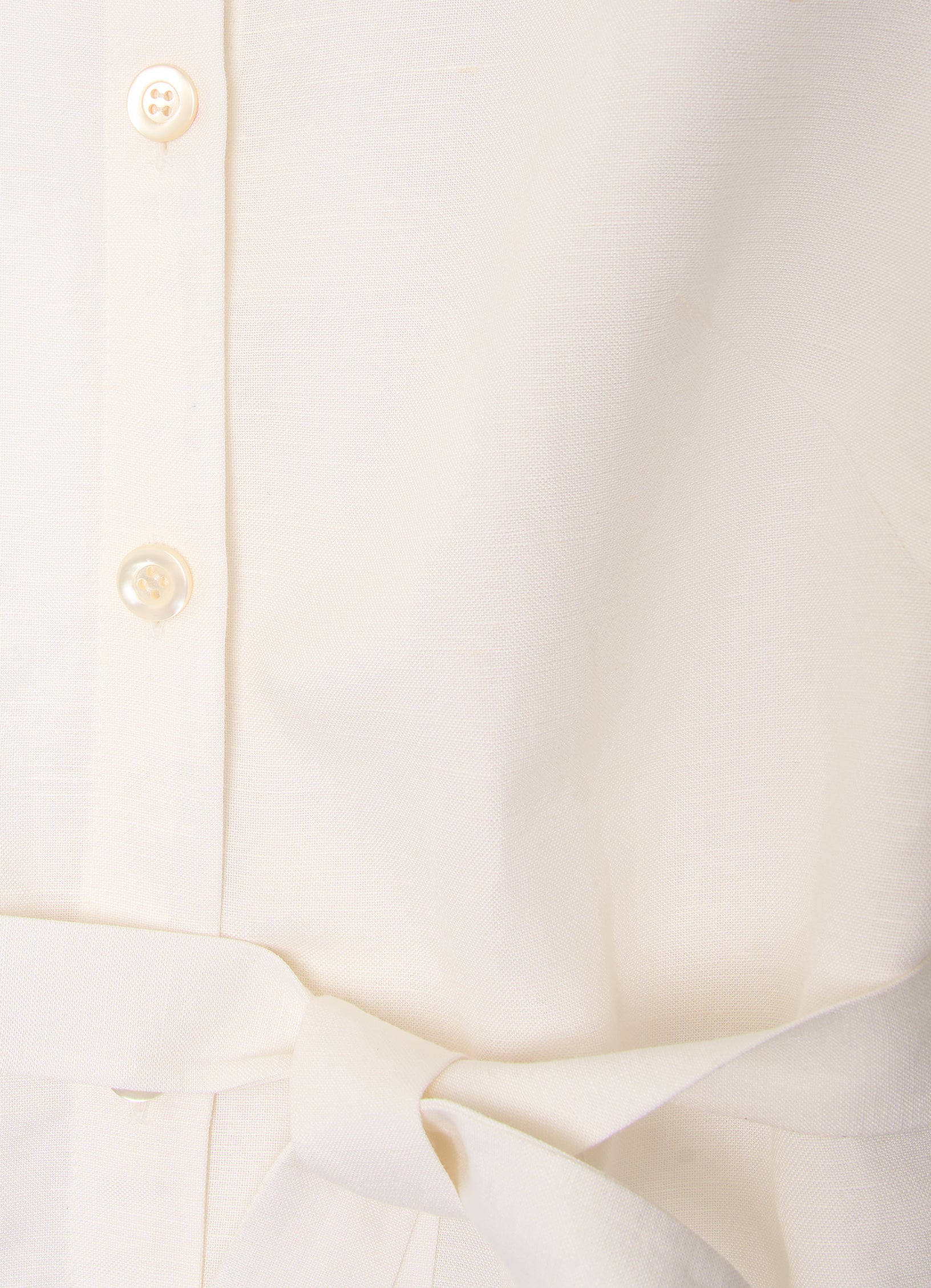 White shirt dress detail with mother-of-pearl buttons