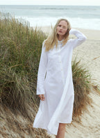 White belted midi shirt dress worn on the beach