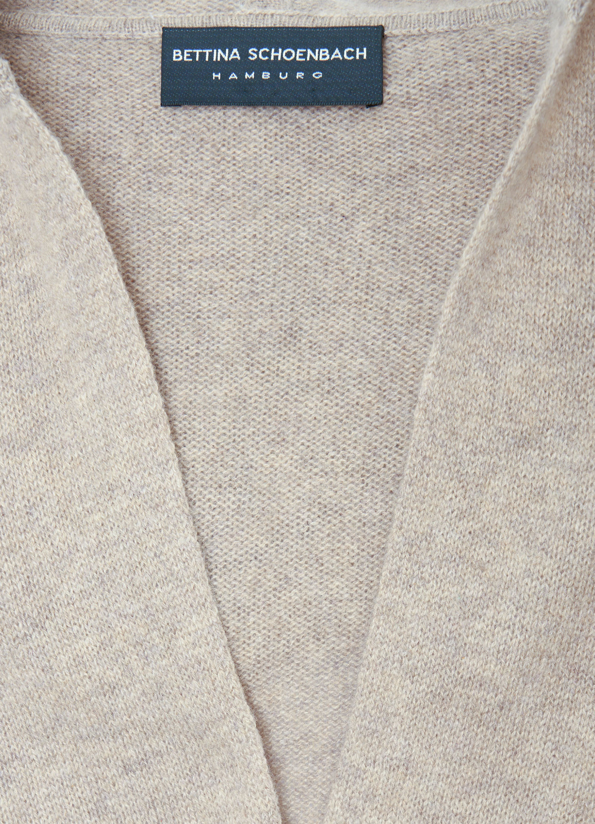 Close-up of light brown cashmere cardigan knit