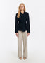 SCHOENBACH virgin wool wrap jacket in deep navy with sewn-on waist belt, full-length front view