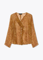 Ruffled silk blouse in abstract ozelot print with front ruffle detailing