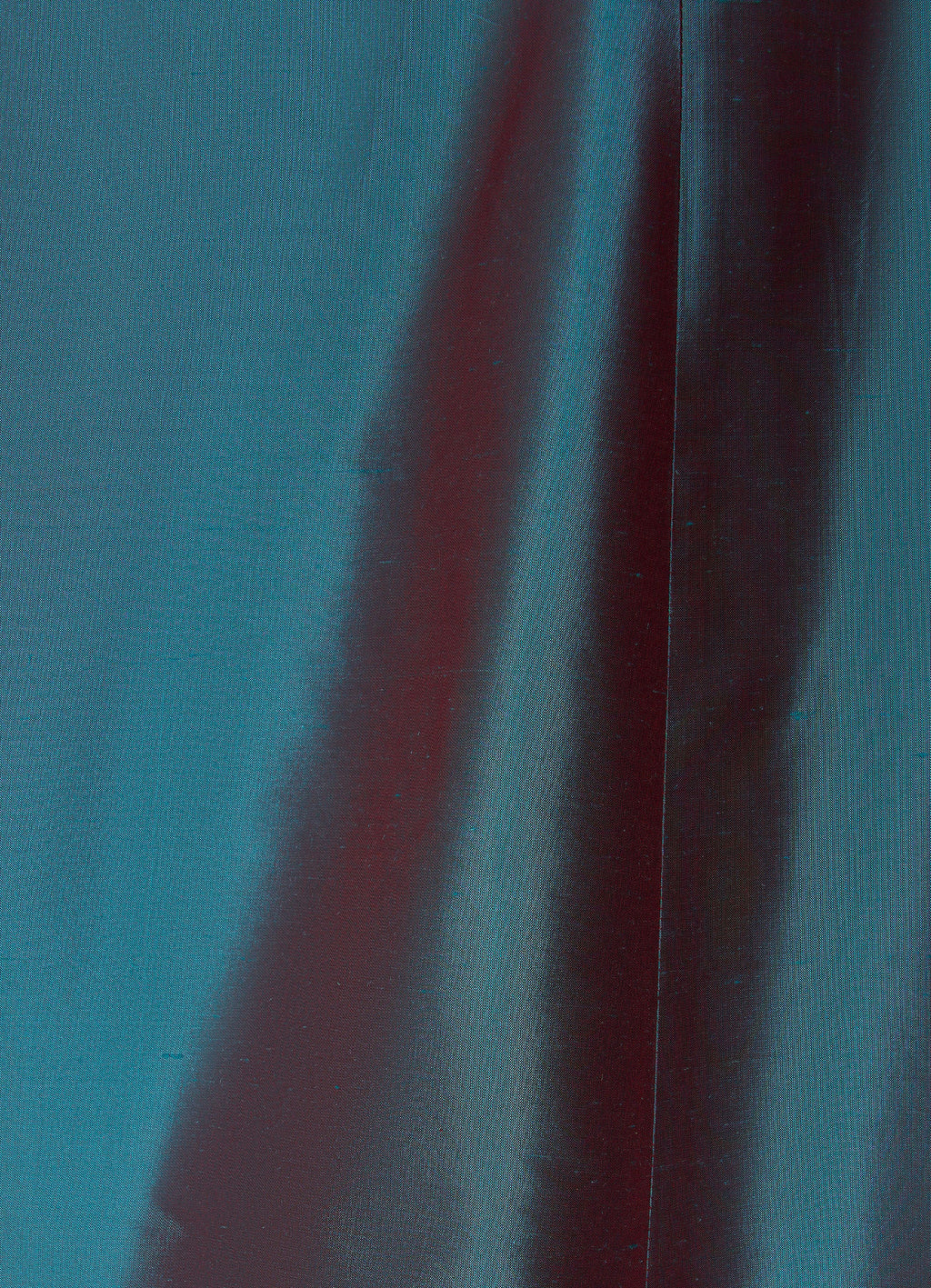 Silk taffeta long skirt in petrol detail showing structured texture and seam finish