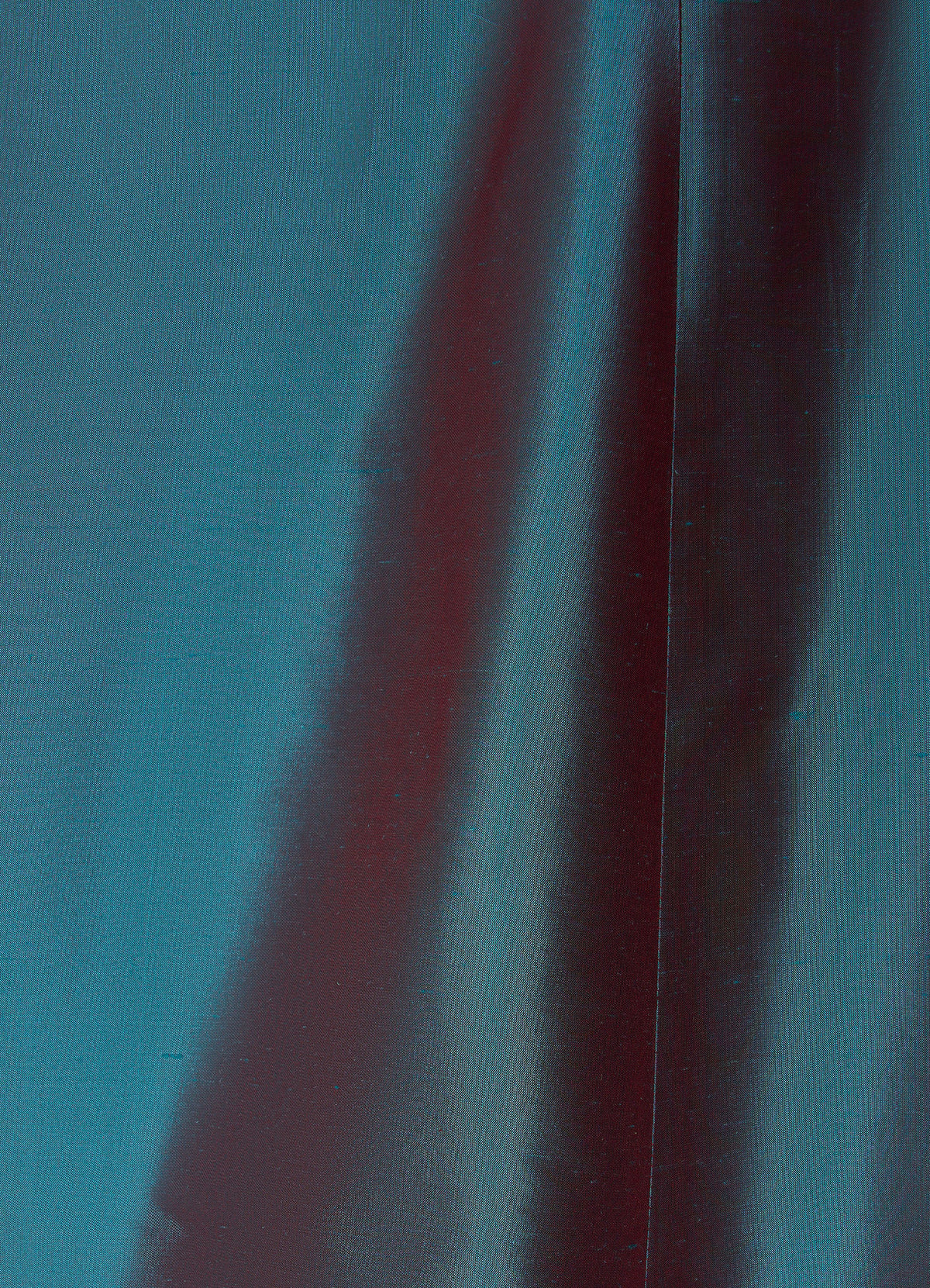 Silk taffeta long skirt in petrol detail showing structured texture and seam finish