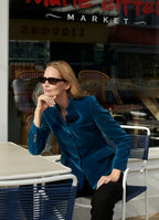 Tailored velvet jacket in petrol worn with black trousers, worn by model Katrin Thormann in Marie Eiffel on Shelter Island
