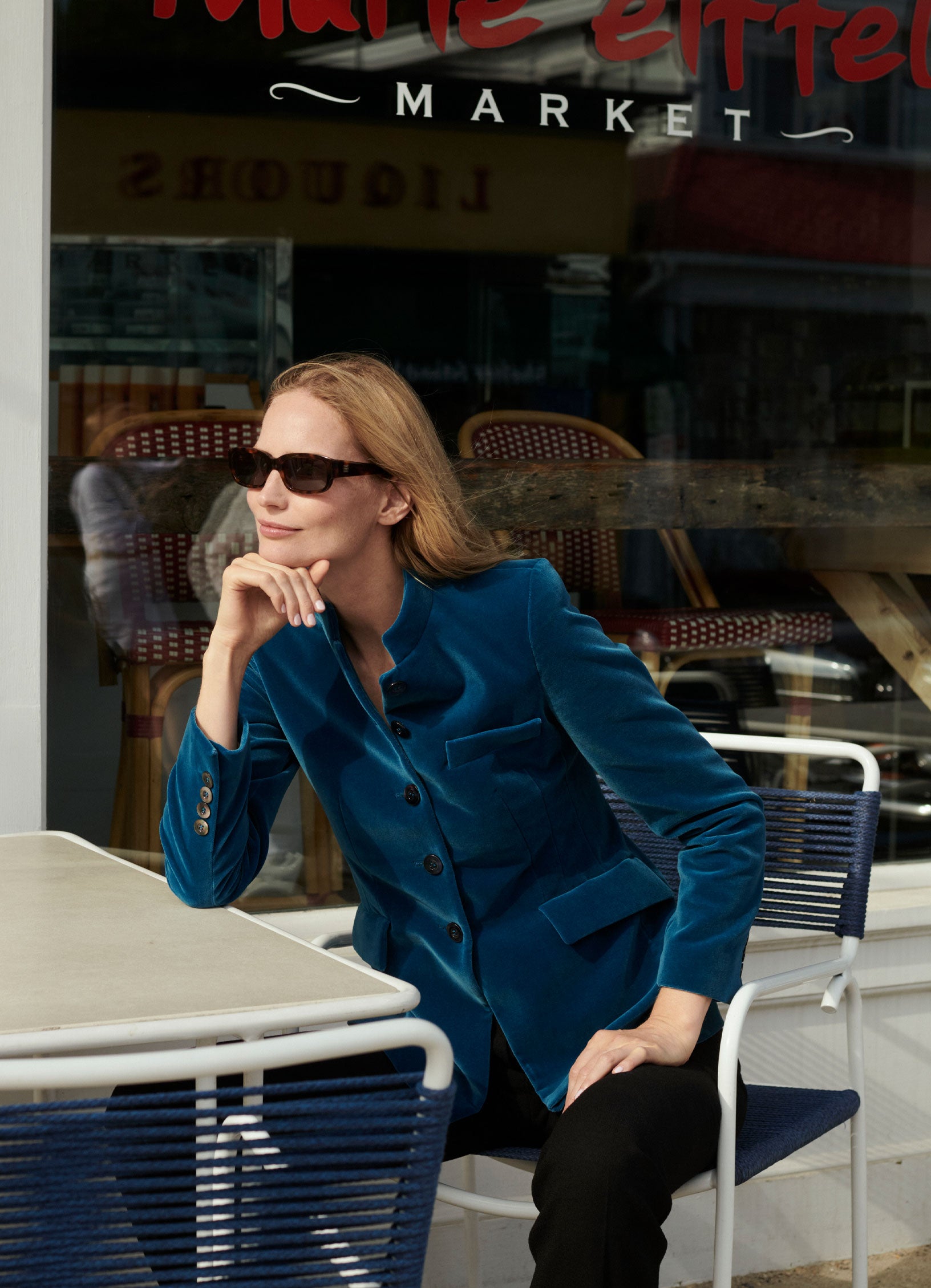 Tailored velvet jacket in petrol worn with black trousers, worn by model Katrin Thormann in Marie Eiffel on Shelter Island