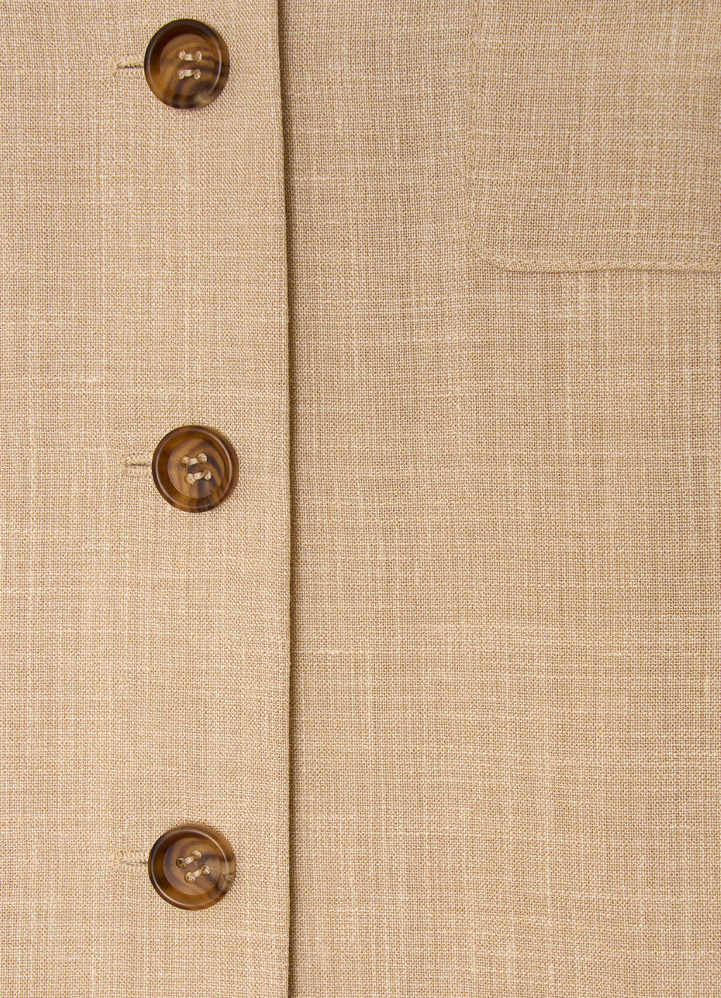 Detail of wool-cashmere shirt jacket showing horn buttons and textured fabric
