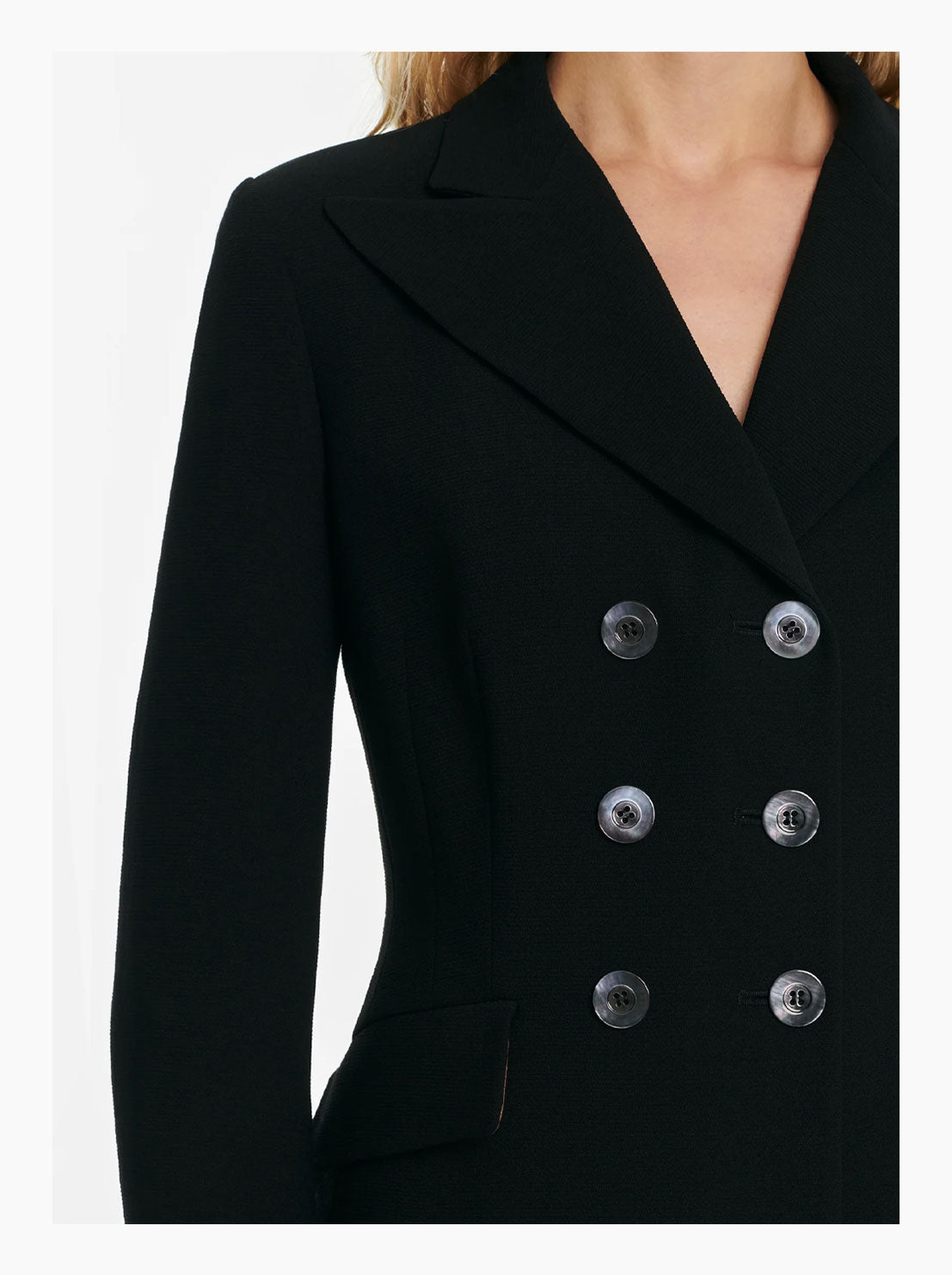 Double breasted blazer close up of the mother of pearl buttons
