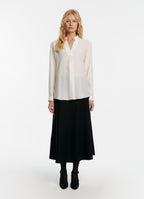 SCHOENBACH signature silk crepe de chine blouse styled with skirt, not tucked in