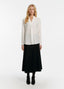 SCHOENBACH signature silk crepe de chine blouse styled with skirt, not tucked in
