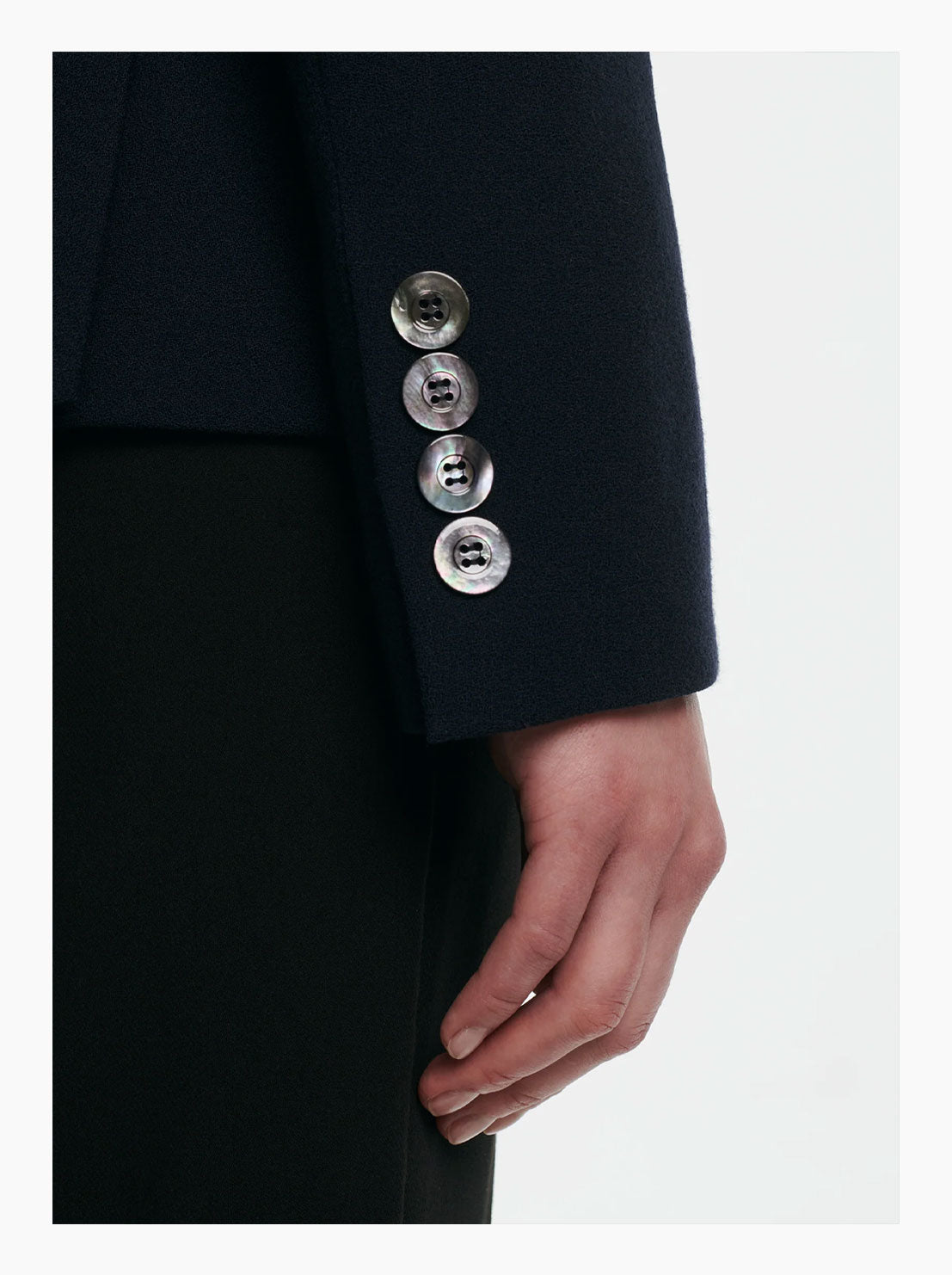 Virgin wool blazer showing the cuff with mother of pearl buttons