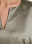 SCHOENBACH silk shift dress in sage green, neckline detail