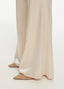 SCHOENBACH wide-leg satin trousers in ivory, fabric detail showing fluid satin drape