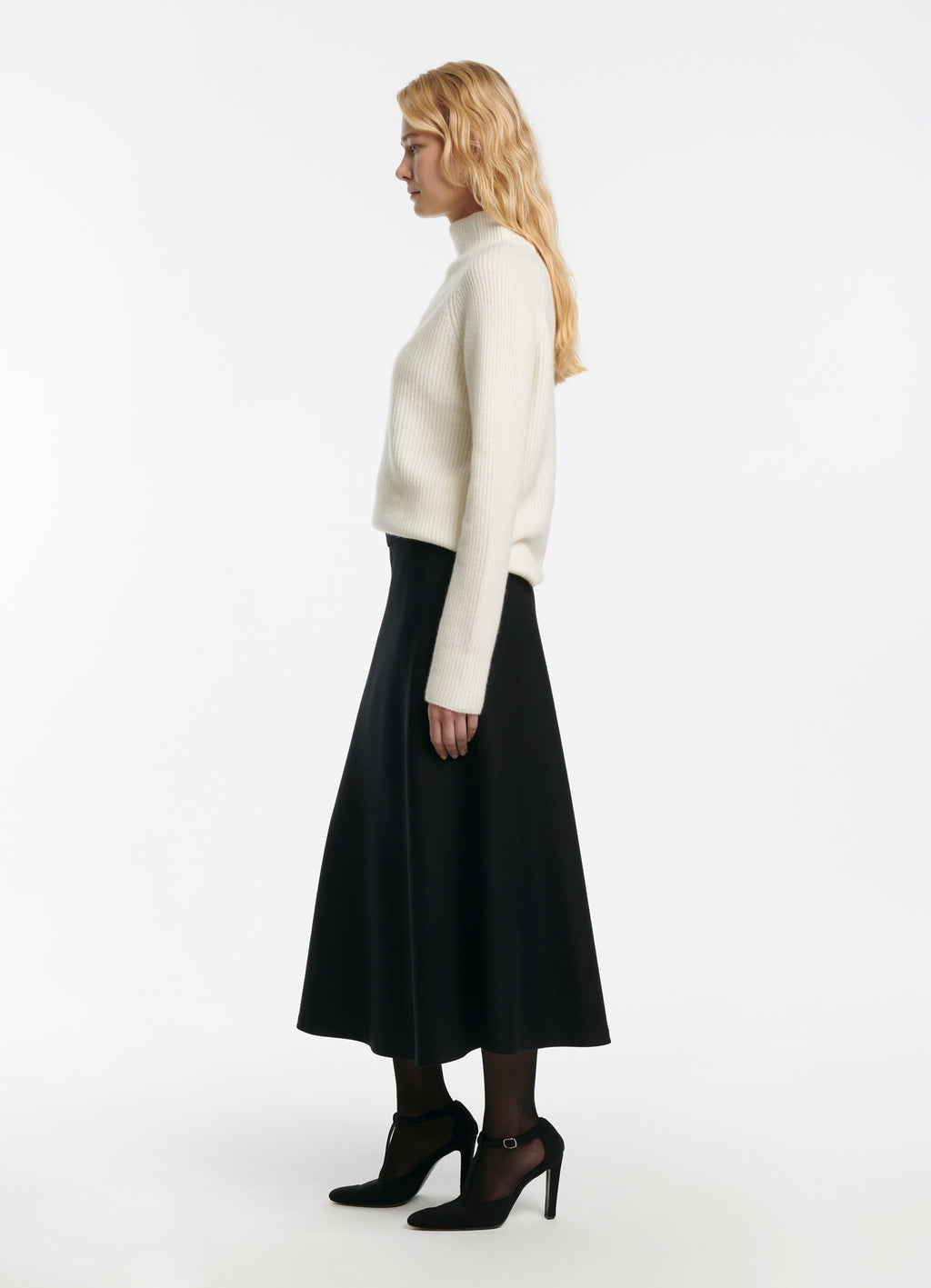 SCHOENBACH wool piquet midi skirt in black, side view showing A-line silhouette