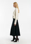 SCHOENBACH wool piquet midi skirt in black, side view showing A-line silhouette